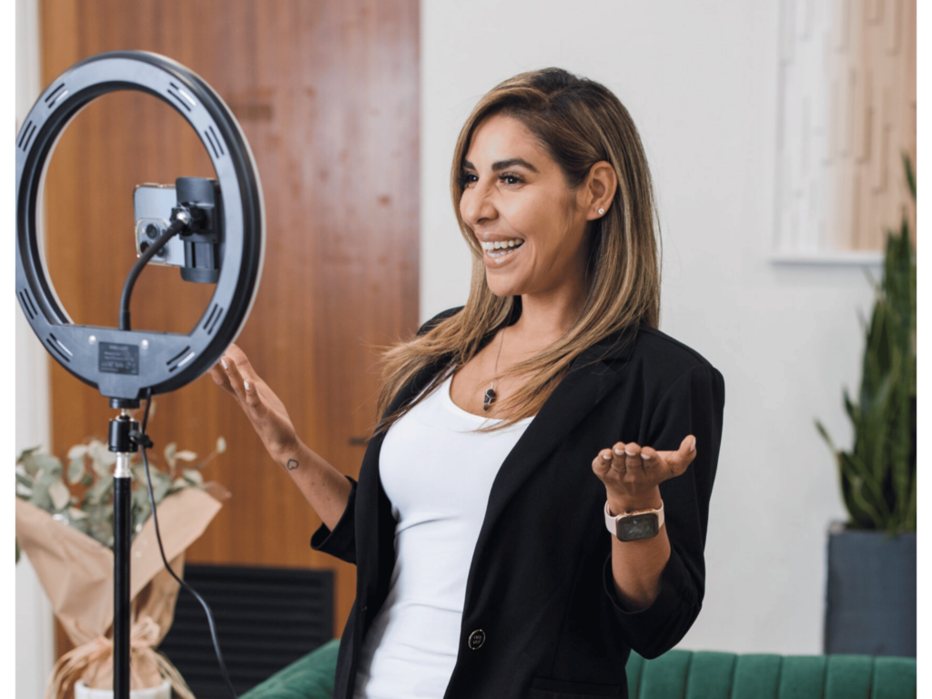 Ring Light Woman Smiling Blonde Highlights Business Casual 